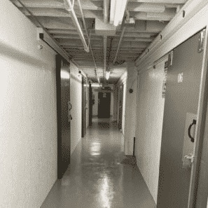 hallway of a secure self storage unit with white walls